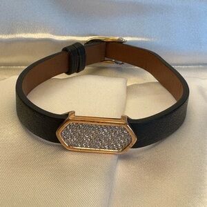 KEEP Collective bracelet with large rose gold center charm with gems.